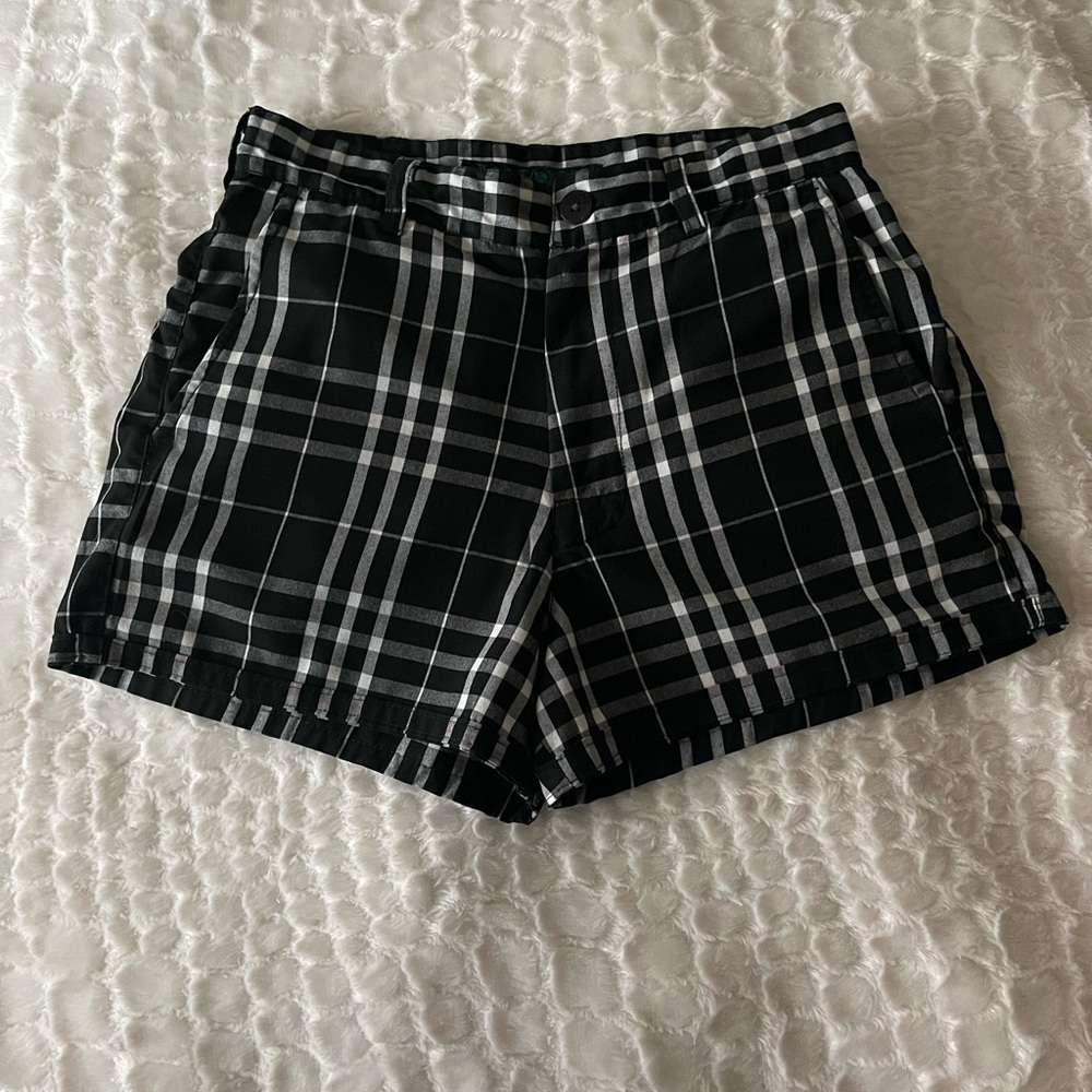 …Lost: black & white checkered shorts. Size (30).